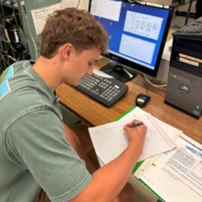 Jack Peterson, writing a logbook entry for a data collection  run with the Eljen#2 neutron detector. The  computer shows software used to collect  data and the MPD4 adjustable parameters.