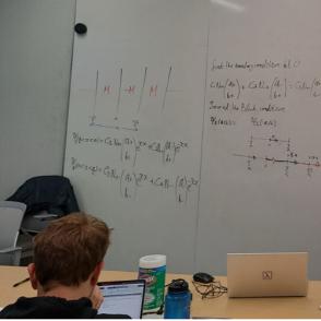 Jonathon Dvorscak in front of a whiteboard