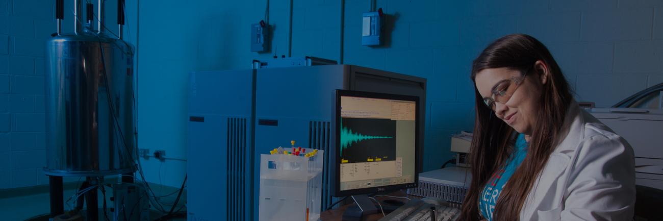 A chemistry student in the NMR lab