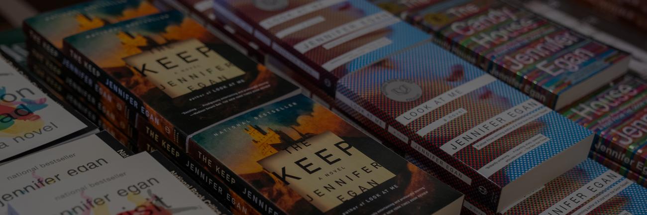 A plethora of Jennifer Egan books on a table when she spoke at the university.