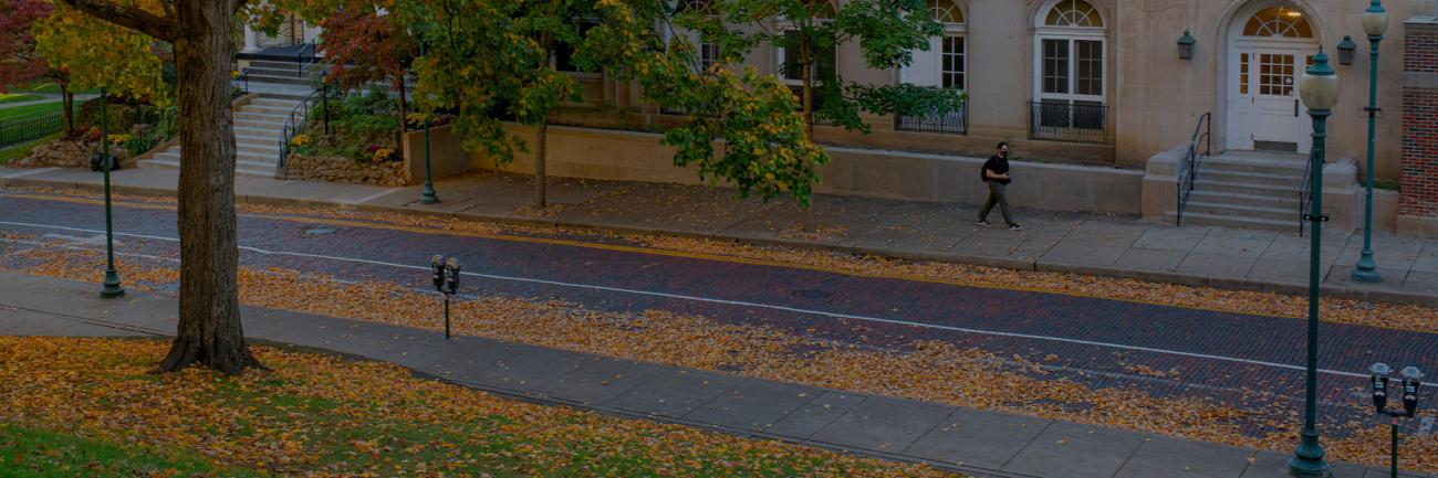 Students walk along the front of Gordy Hall, home to the Linguistics Department.