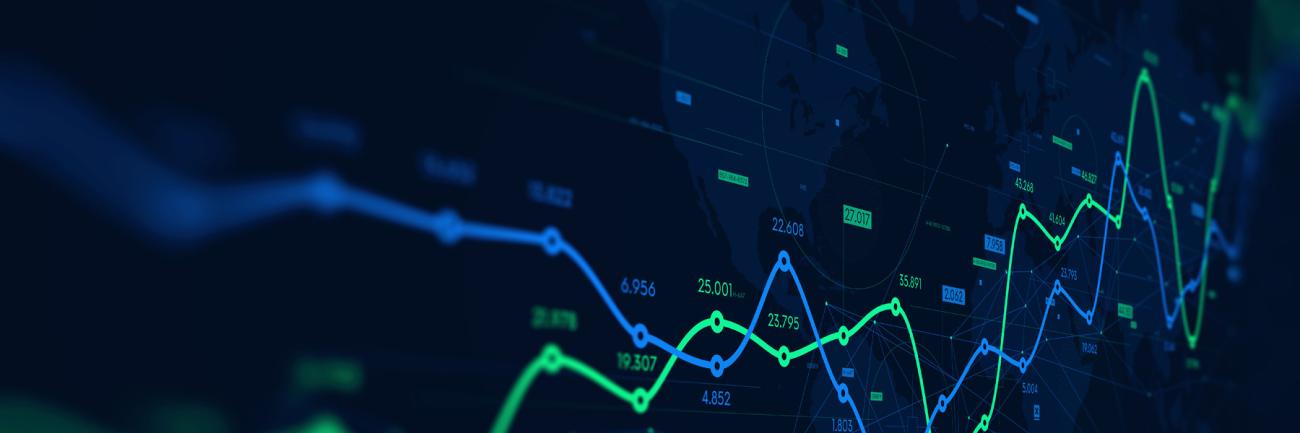 A monitor displaying digital analytics data visualization and financial schedule