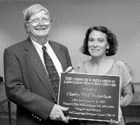 Charles P. Richardson and Mary Jane Kelley, holding plaque