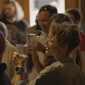 Patrons taste a student-designed beer at Jackie O's