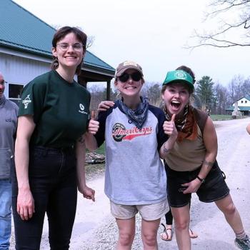 Students smile and pose while working with AmeriCorps