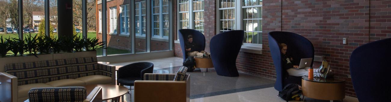 Students sit and study in the atrium on the first floor of Patton Hall.