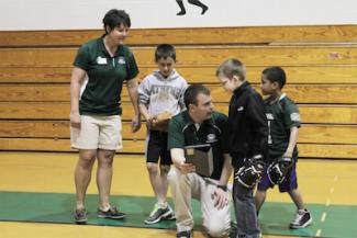 Coach talking to his young players.