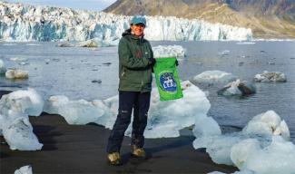 Nina Adjanin in the snow by a glacier.