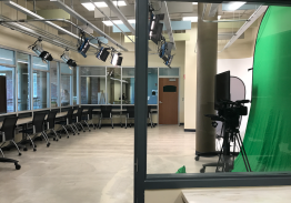 Blackbox Lab showing a row of desks and an infinity wall.