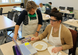Lisa Williams helping student in class