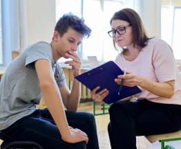 Counselor talking with a student.