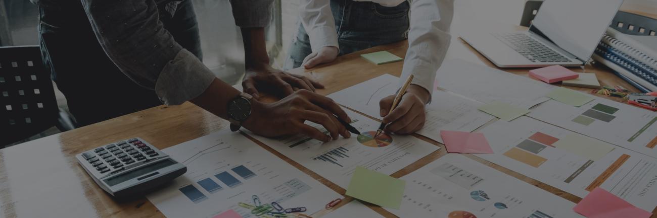 Project managers working with business documents