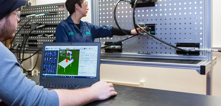 Man on laptop using hydraulic software
