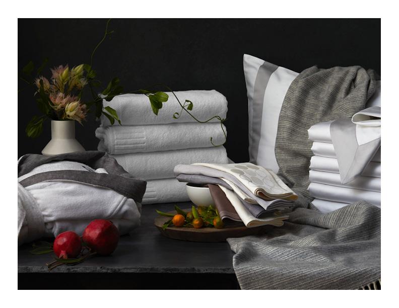 Still life with linens, flowers, and fruit