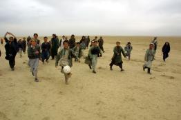 A group of children playing with a ball