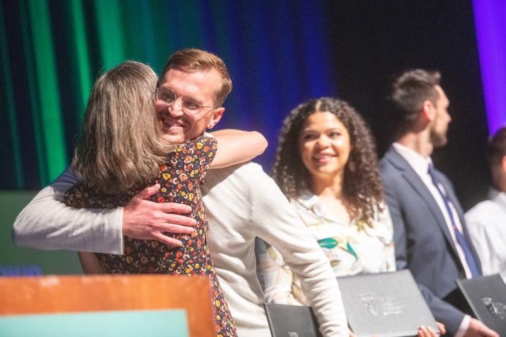 A photo of David Strawhun receiving a recognition award