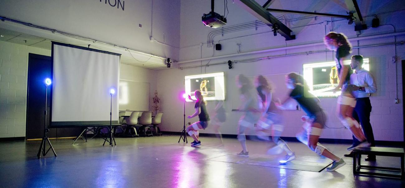 Researchers study human movement as subjects run in a lab.