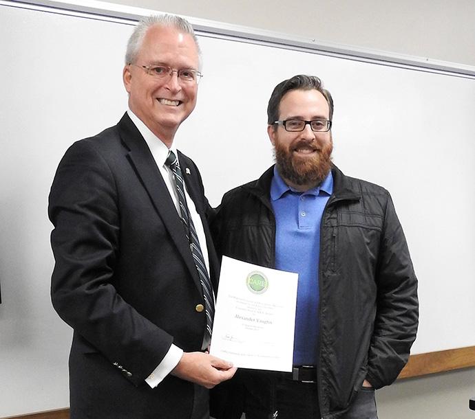 Alex Vaughn receives award