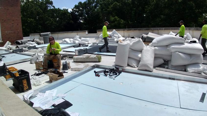 Omni Ecosystems working on the Green Roof. 