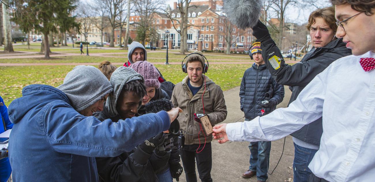 Film crew recording a video on the college green