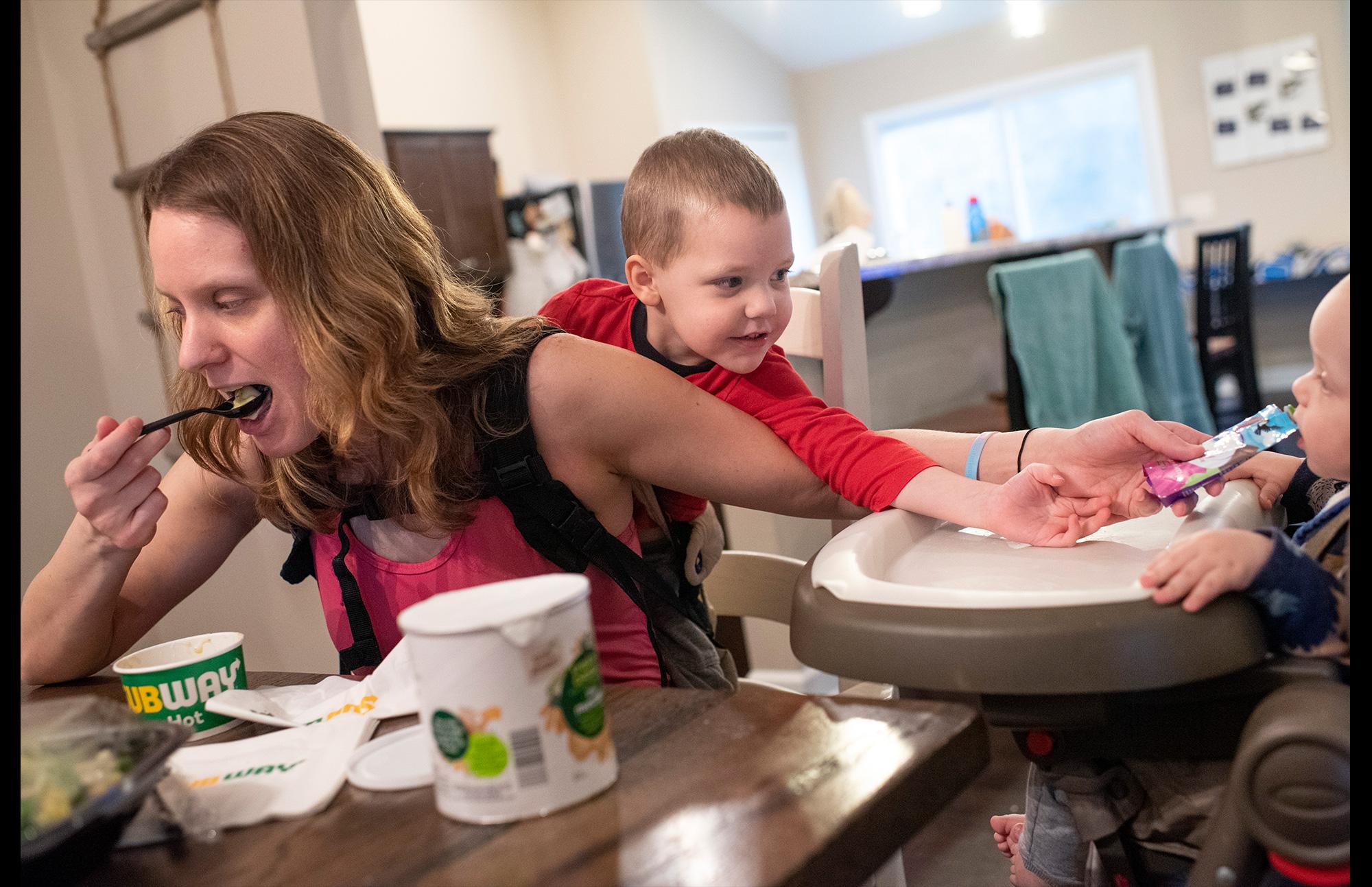 woman with children, eating meals
