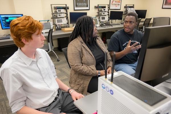 Students work with an advanced 5G mobile communications instructional and research platform.