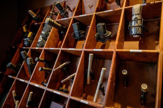 various types of microphones stored in a box structure