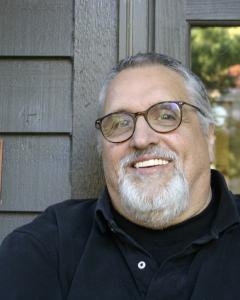 Faculty member Chuck Borghese smiles.