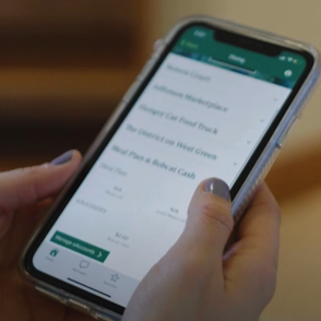 hand holding a smartphone with an open app