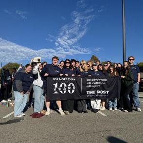 The Post staff holding a banner