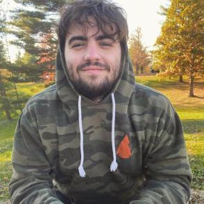 Man in camo hoodie outdoors
