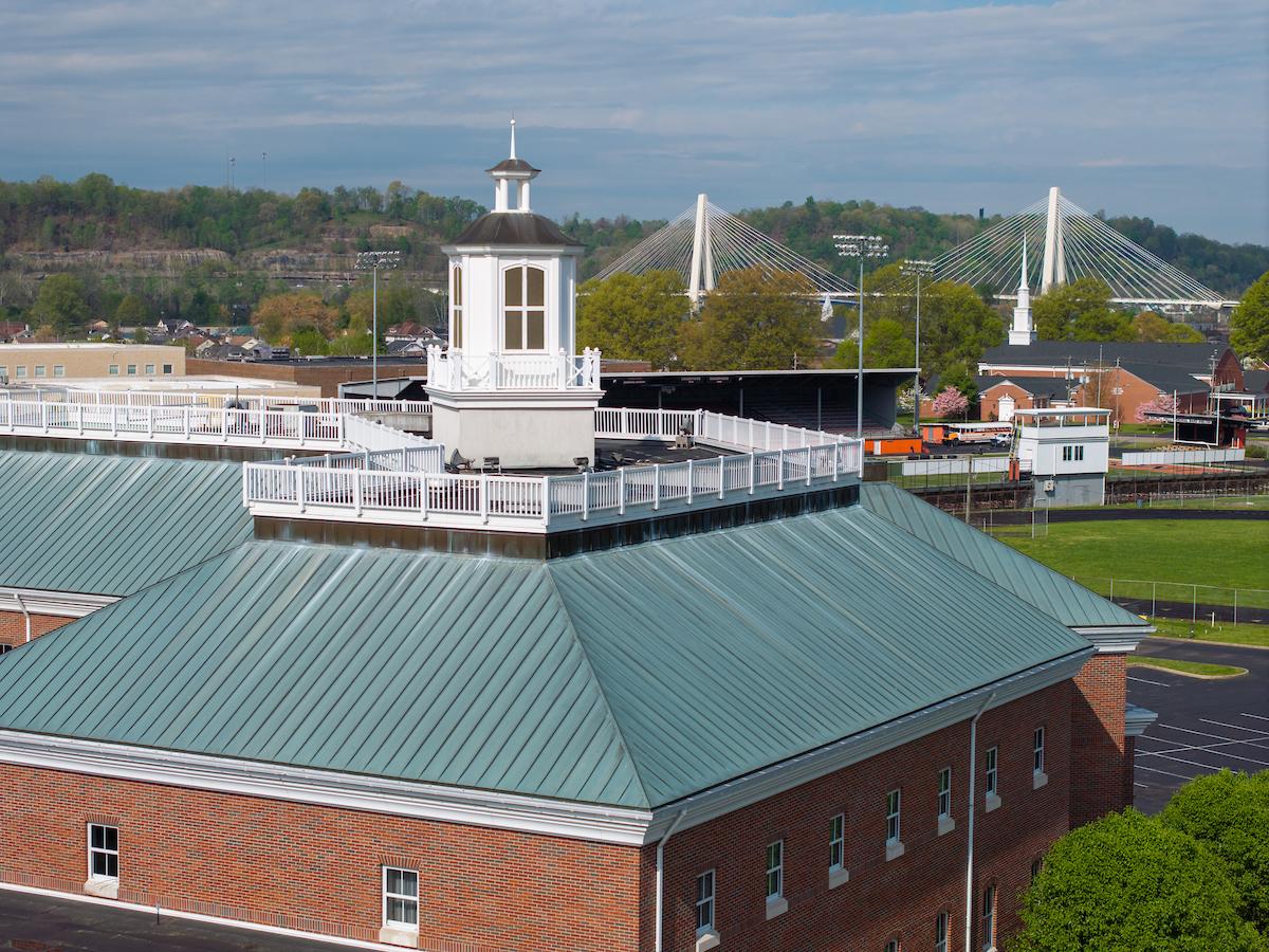 Aerial view of Southern campus with suspension bridge in background