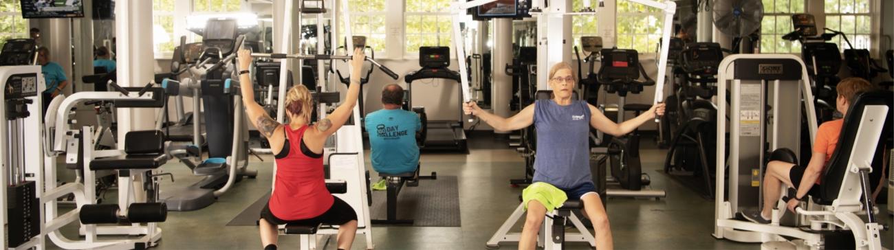 Members using WellWorks fitness center machines