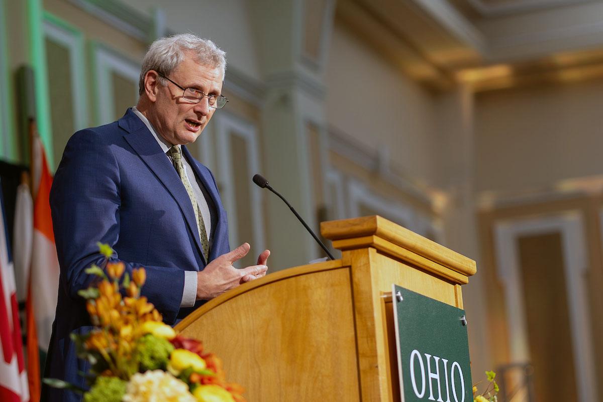 Provost Donald J. Leo speaks at a podium.