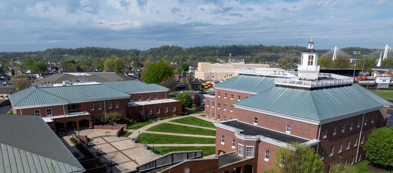 Aerial view of Southern campus with suspension bridge in background