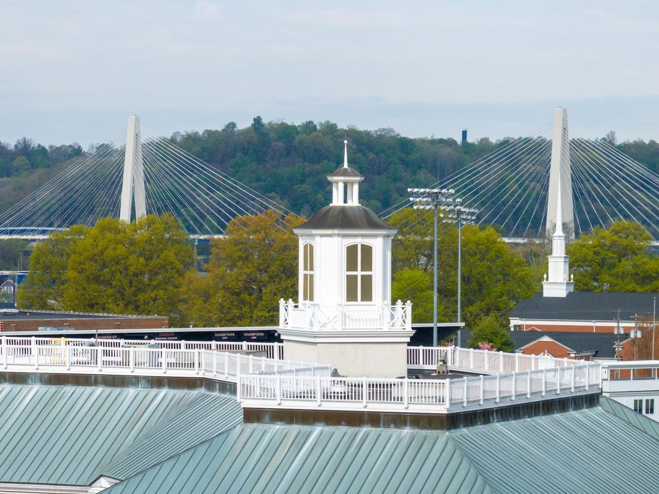 View of campus with two suspension bridges in background
