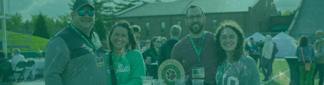 Two couples smiling at camera at Taste of Brewing alumni event.