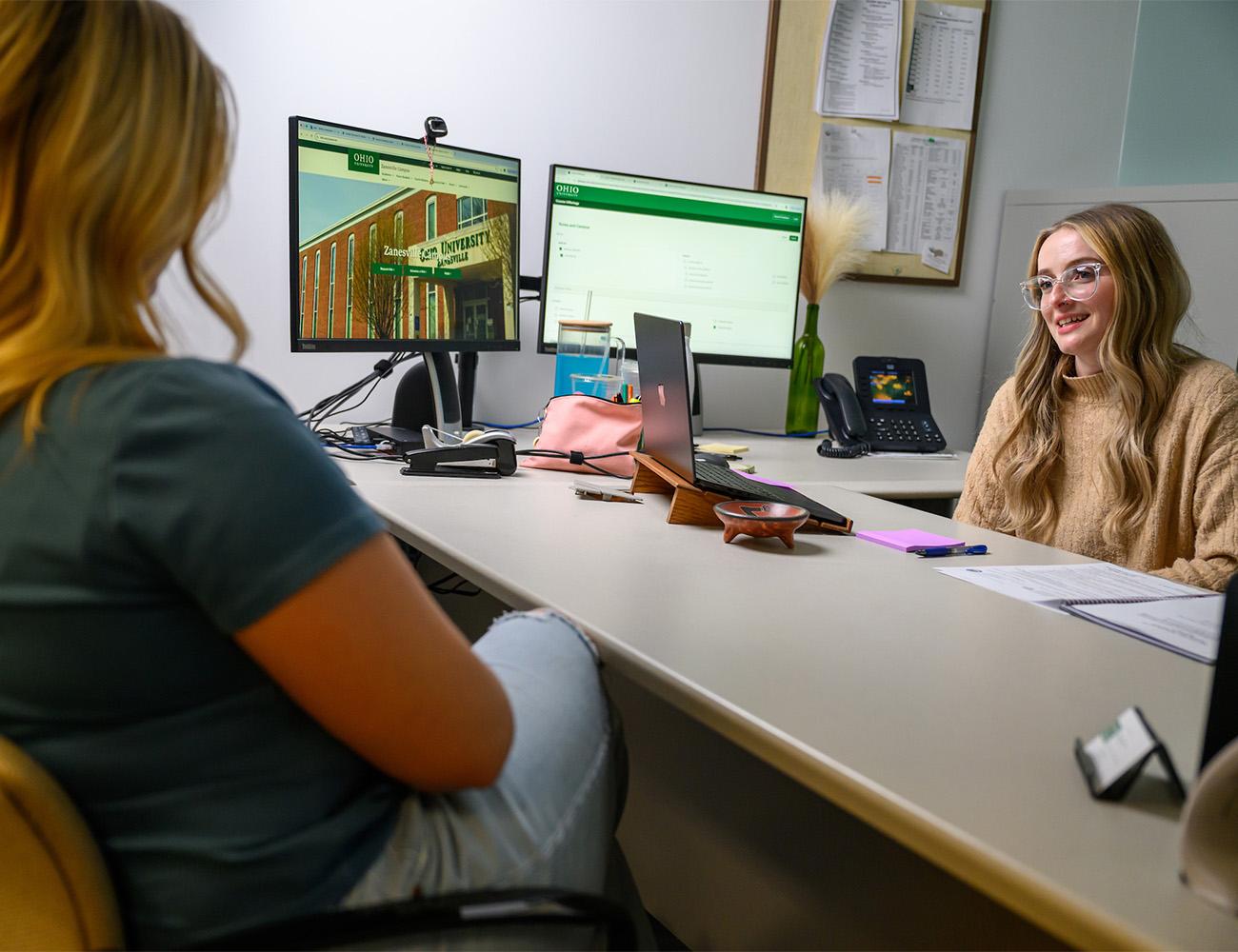 an advisor talks with a student