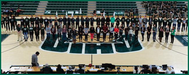 Reception during half time of a basketball game where Women were celebrated