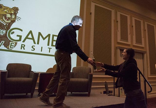 John Bowditch distributing an award at the Business of Games Summit