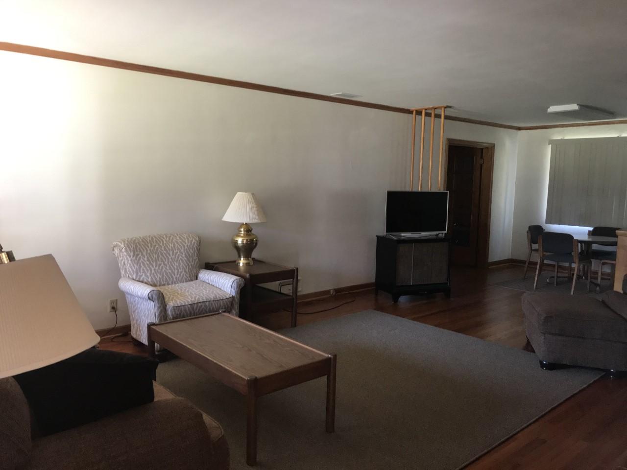 Living room and breakfast nook with wood floor
