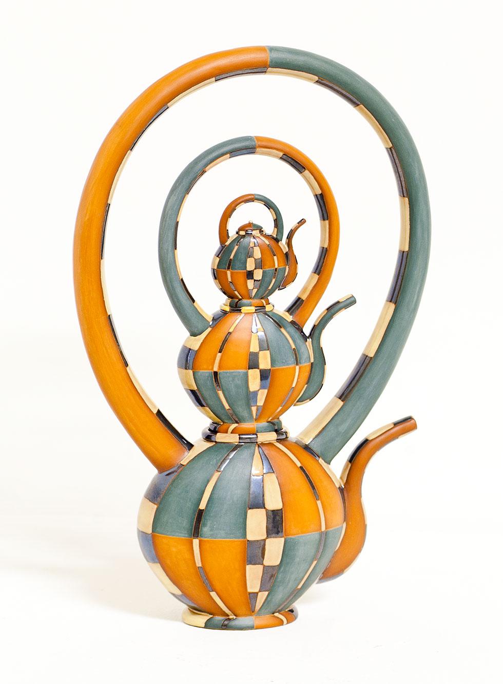 Nesting Teapots, 1995, Gail Busch, earthenware, slip and glazes, 11.5 in. x 6.75 in. x 2.5 in. (29.2cm x 17cm x 6.4cm), 97.005.1. Gift of the artist.