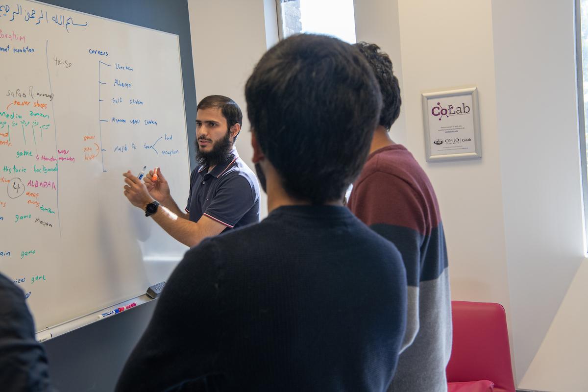 People at a white board