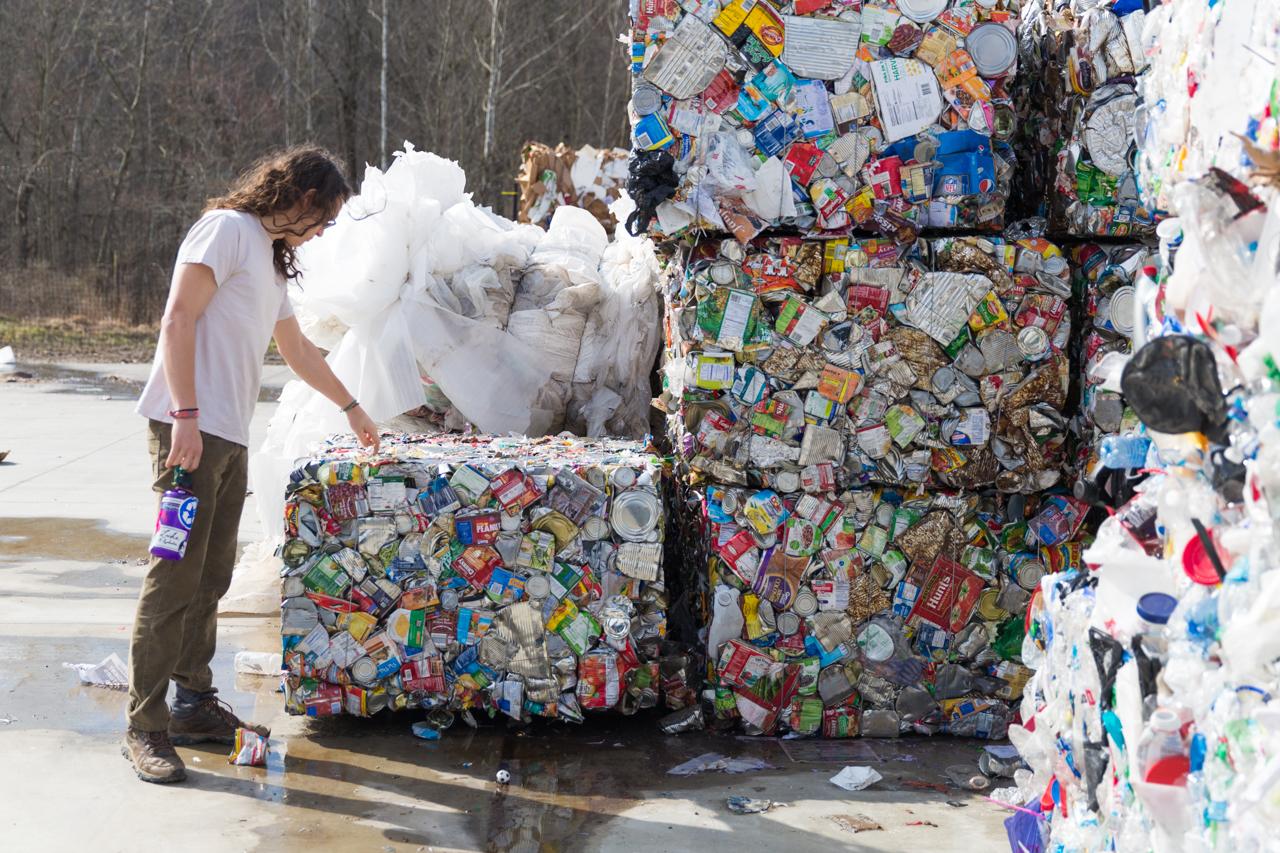 Recycling employee observing a bale of aluminum cans at the AHRC site