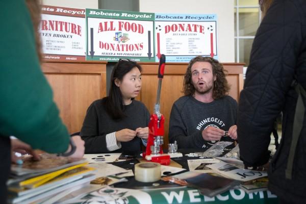 2 recycling employees tabling 