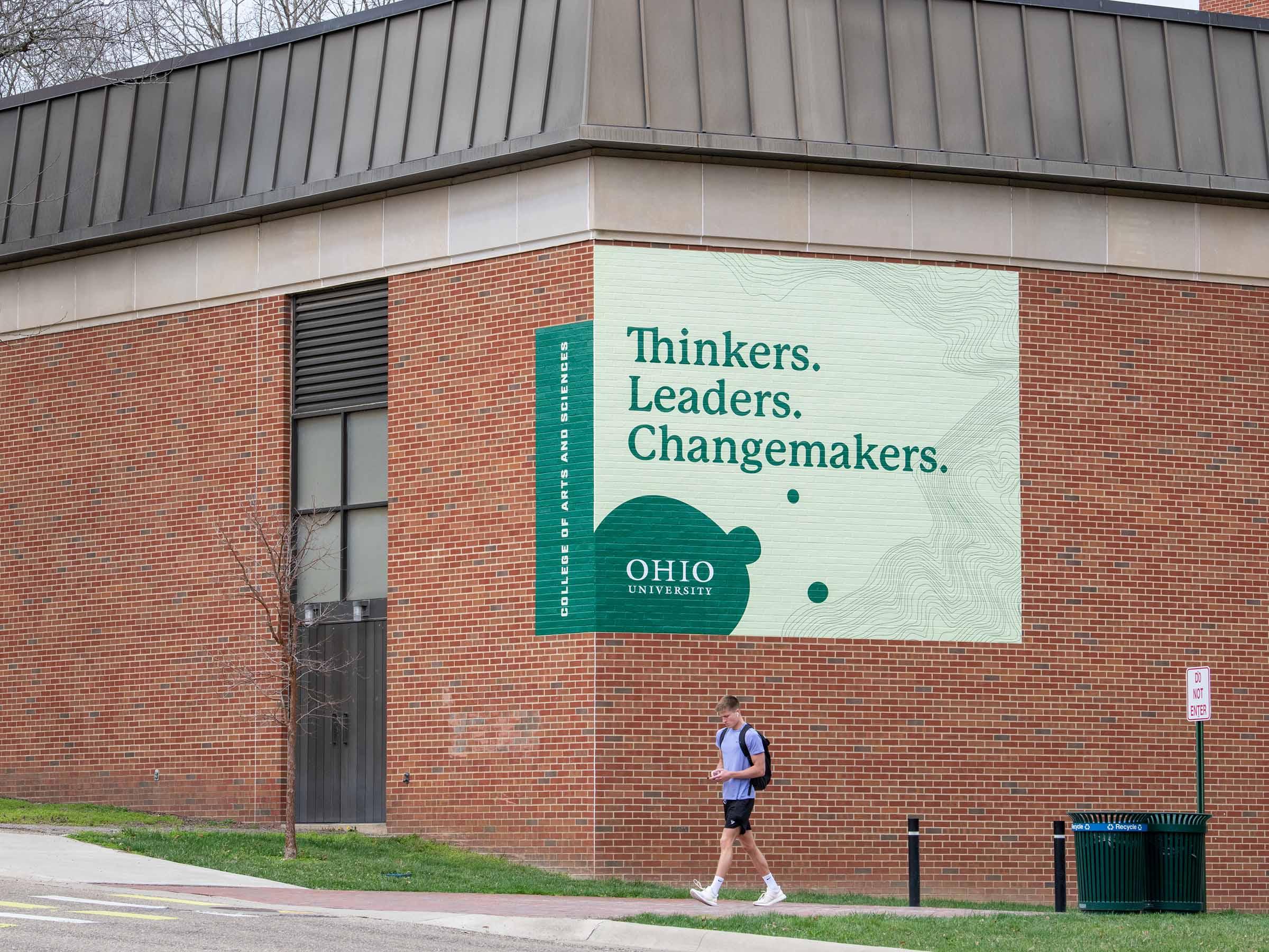 exterior building banner promoting the College of Arts and Sciences