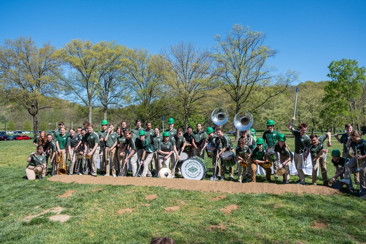 Marching 110 shoveling ceremonial dirt