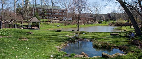 Emeriti Park, featuring green space, a gazebo, and pond.