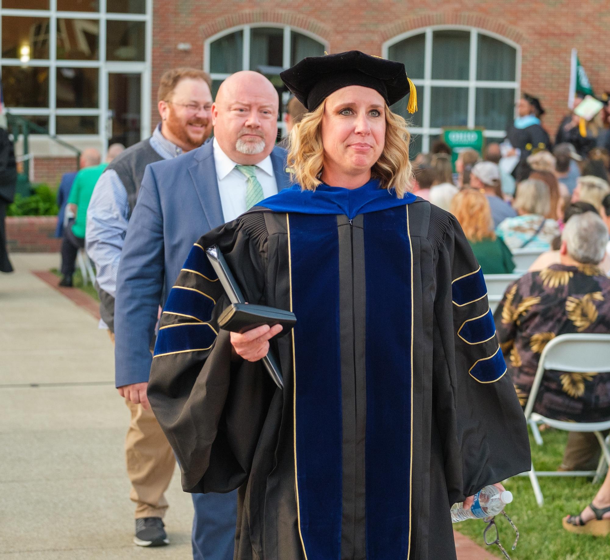 Dean Marinski walking in graduation ceremony