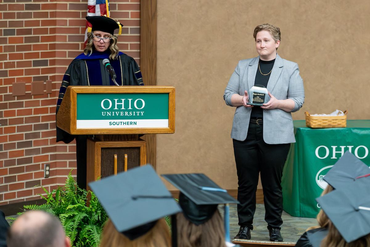 Alumni accepting award from Dean